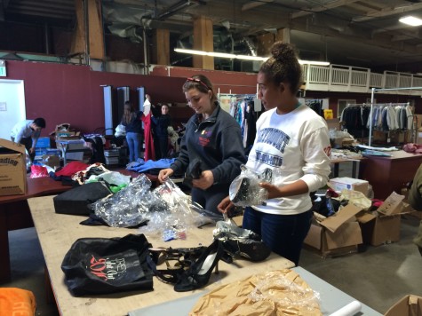 Marymount students sort out donations to the Cinderella Project. Photographer: Grace Rector '17.