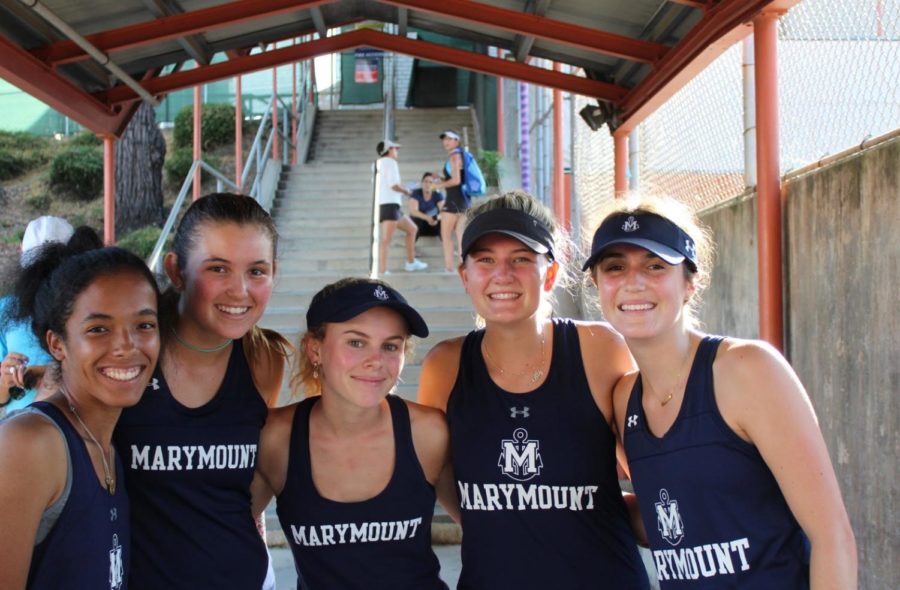 Seniors on the Marymount Varsity tennis team celebrate a massive defeat against Beverly Hills High School at the beginning of the season. They will be dearly missed next year!