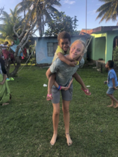 Junior Brooke Pierpoint and her new friend Taru. She is hosting an afternoon kids club for the children of Momi village. Taru and Brooke became instant friends. Brooke taught her English and American games.