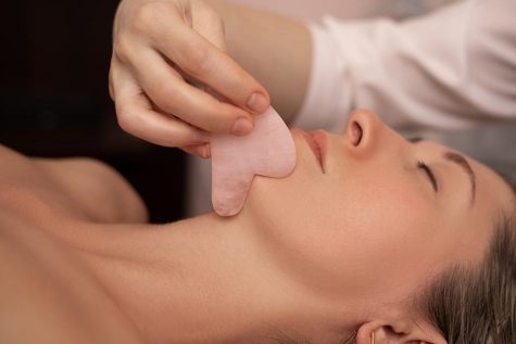 The ancient Chinese practice of gua sha has been popularized as a way of slimming or shaping the face. (Photo courtesy of Forbes)