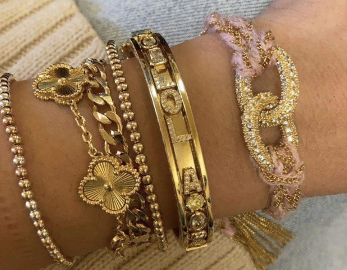 A wrist-full of gold bracelets. (Courtesy of Ashershay Designs)