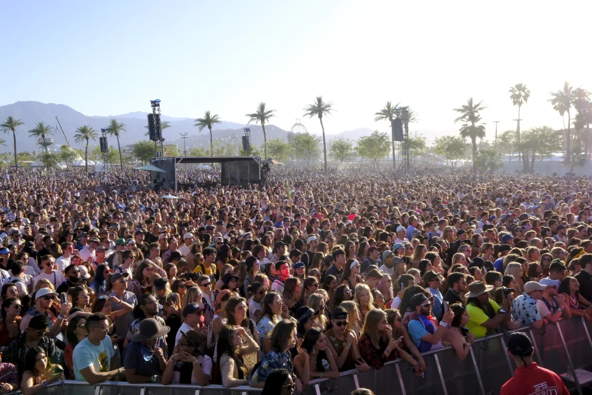 Several amounts of festival-goers standing in front of the stage watching the artists’ Coachella performance (Frazer Harrison/Getty Images)