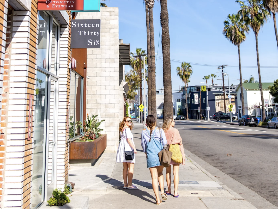 Three girls shopping and walking on the streets of Los Angeles. Photo courtesy of Abbot Kinney Boulevard.